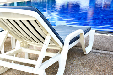 Chair and swimming pool in the resort.