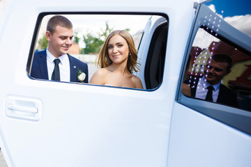 Newlyweds in a car