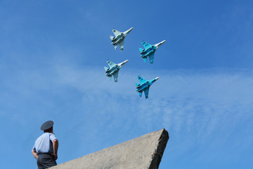 squadron of military airplanes flying in the sky