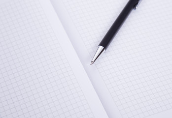 Ball pen and office pad, focus on the tip