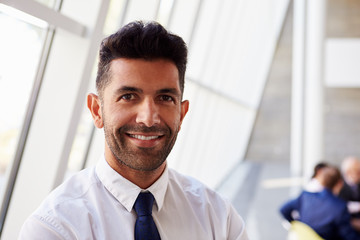 Fototapeta premium Portrait Of Hispanic Businessman In Modern Office