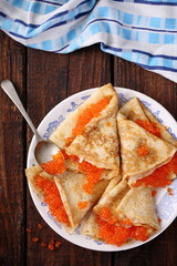 Pancakes with red caviar at home