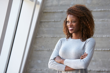 Fototapeta premium African American Businesswoman Standing Against Office Wall