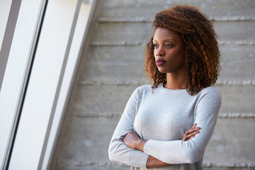 Fototapeta premium African American Businesswoman Standing Against Office Wall