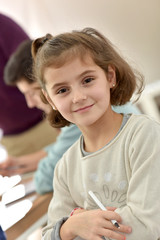 Portrait of smiling school girl in class