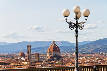 Fototapeta na wymiar Beautiful view over the city of Florence, Italy, with the Cathedral and a beautiful street light