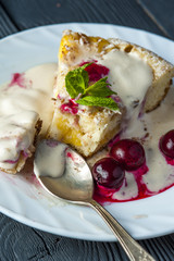 Piece of pineapple pie and cherries with ice cream
