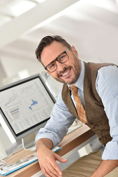 Middle-aged businessman with eyeglasses in office