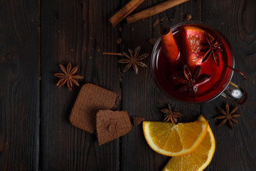 Mulled wine on the dark old wood background