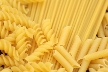 raw macaroni and spaghetti photographed close
