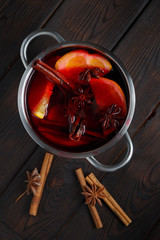 Mulled wine on the dark old wood background
