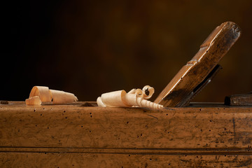 Hand plane on a wooden workbench.
