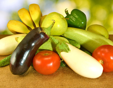 image of various vegetables on the table on green background closeup