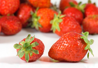 ripe strawberry on a white background closeup