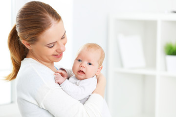 newborn baby in embrace of mother