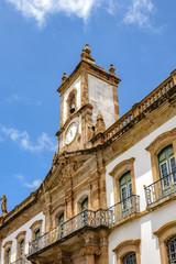 Fototapeta na wymiar Historic clock and bell tower facade at Ouro Preto city
