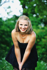Naklejka premium Young girl in the garden