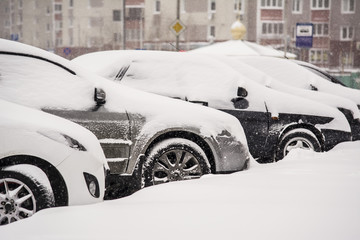 car in the snow in the winter - obrazy, fototapety, plakaty
