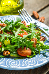 Green salad with avocado, cherry tomatoes and pecan