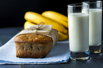 Banana bread, glasses of milk on burlap napkin
