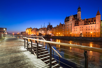 Fototapeta premium Old town of Gdansk at frozen Motlawa river, Poland