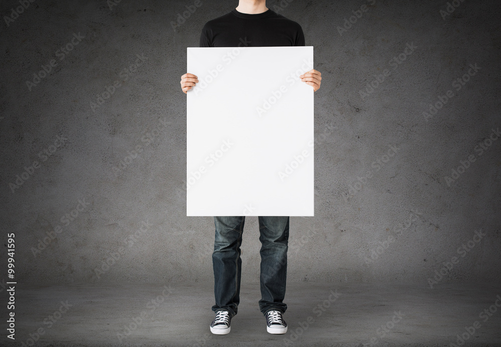 Wall mural close up of man holding big blank white board