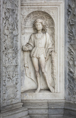 Fototapeta na wymiar Renaissance Statue of Saint Protas: A marble statue of the Christian Saint Protas in an elaborately carved niche in Como, Italy