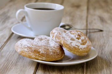 coffee and spanish esnaimadas on a rustic table
