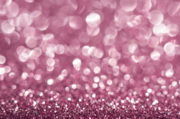 Pink defocused glitter background.