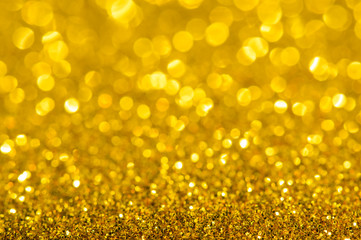 Golden defocused glitter background.
