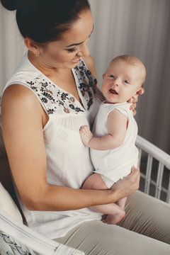 Portrait of happy mother and child in the home environment