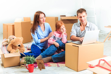Fototapeta premium The happy family during repair and relocation
