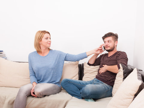 Couple with marriage problems on the sofa