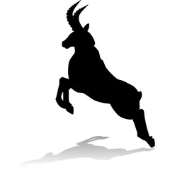 Silhouette of a mountain goat, leaping from a cliff