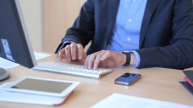 Slow motion of a nice business man in office answering phone getting angry