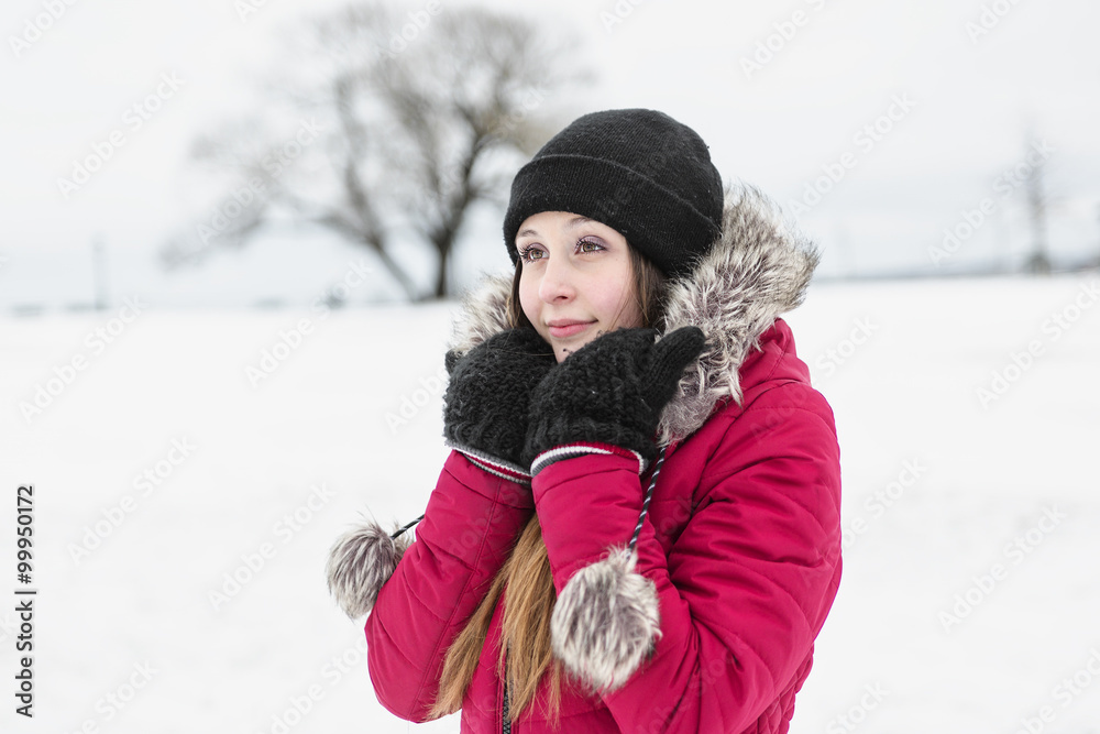 Wall mural winter portrait of cute pretty young girl