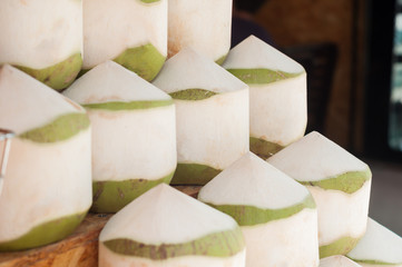 Stack of green fresh coconut