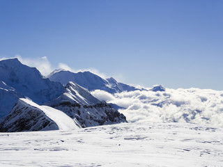 View from Les Grandes Platieres in Le Grand Massif to snowcapped mountains above cloud in the...
