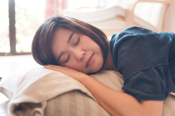 Young asian woman napping