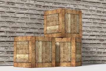 Three wooden boxes near brick wall