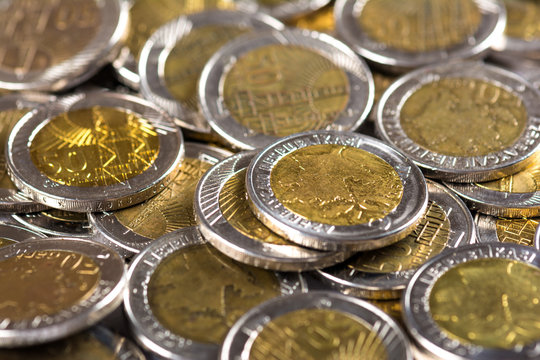 Azerbaijan currency. Pile of 50 qepik coins. Selective focus