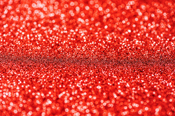 Glitter and glow. Shiny red background. Abstract texture