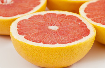 Fototapeta na wymiar Half a red tasty red grapefruit