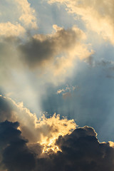 Clouds and sun beams on evening time