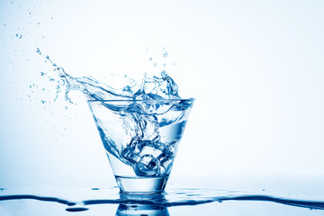water splashing from glass isolated on white background