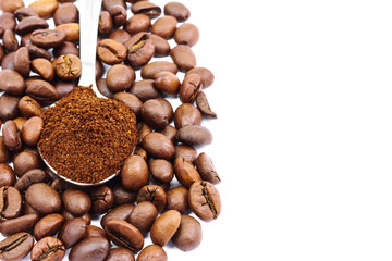 Ground coffee spoon on coffee beans, isolated on white background with space for text