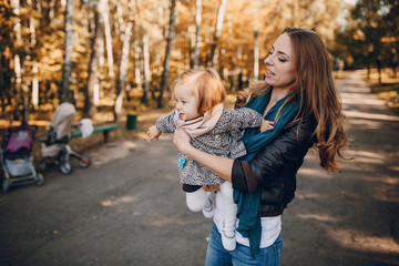 young family walking in the park