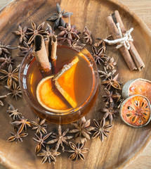 Bael juice and cinnamon sticks in a glass