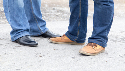 male legs in jeans and shoes