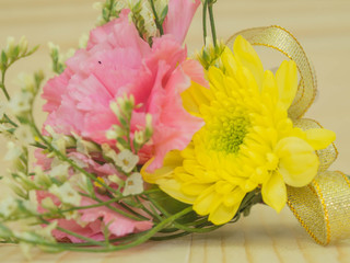 small bouquet on wooden background, close up